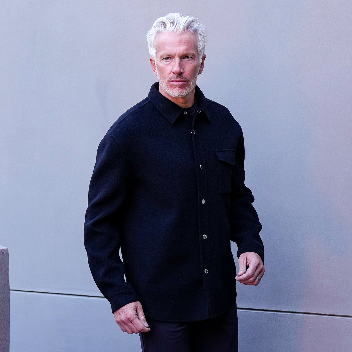 Titan Wool Overshirt in black with button front and chest pocket, studio portrait